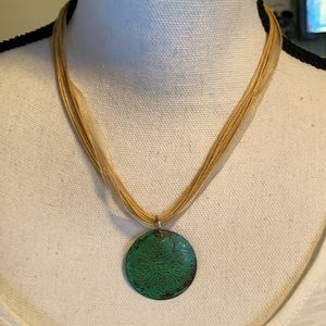 Women’s beautiful necklace with green pendant